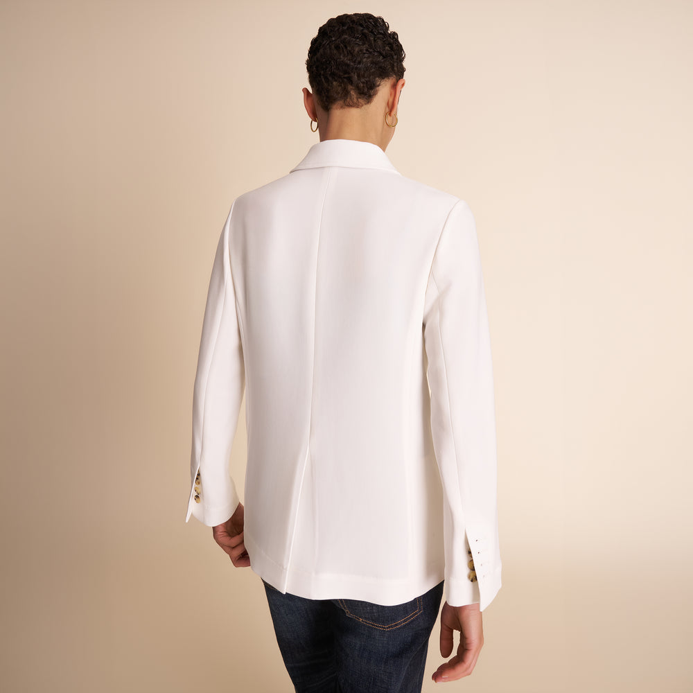 Woman in white blazer.
