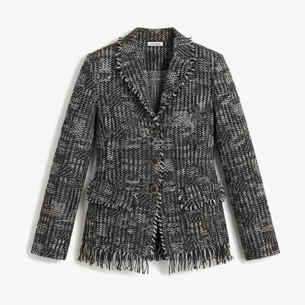 Black and white patterned blazer with frayed edges on a white background.