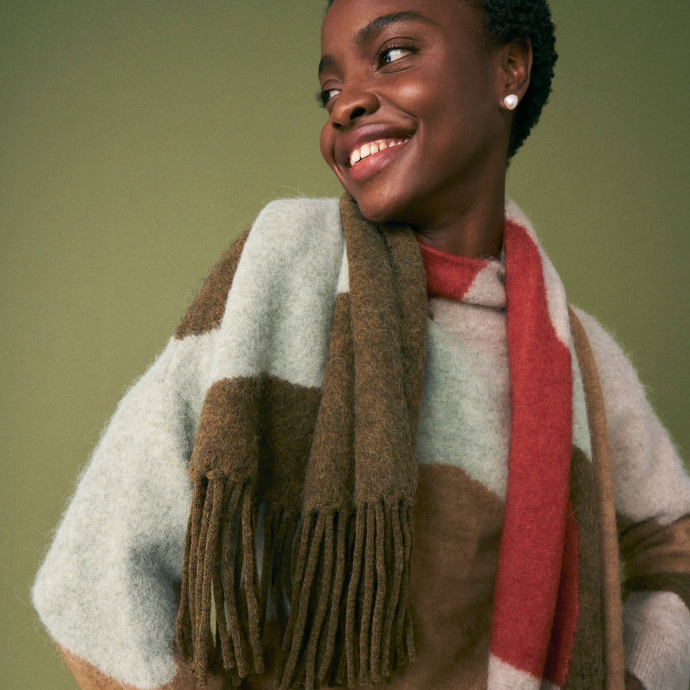 front image of a woman wearing the rajni sweater in multi