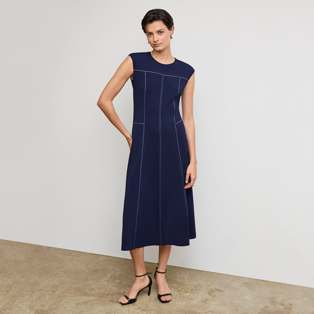 front image of a woman wearing the sylvie dress in soft navy