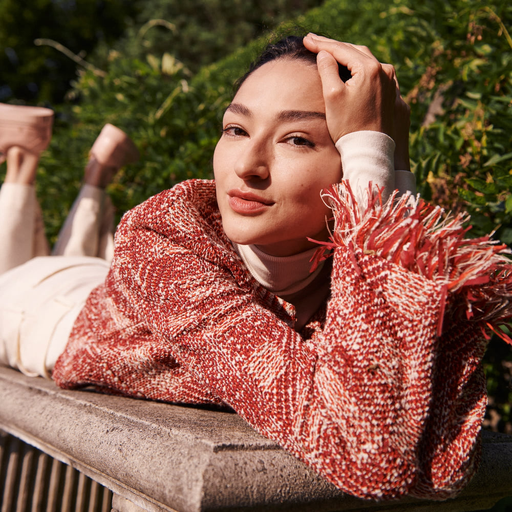Detail image of a woman standing wearing the Lilia Jacket—Interweave in Red Multi