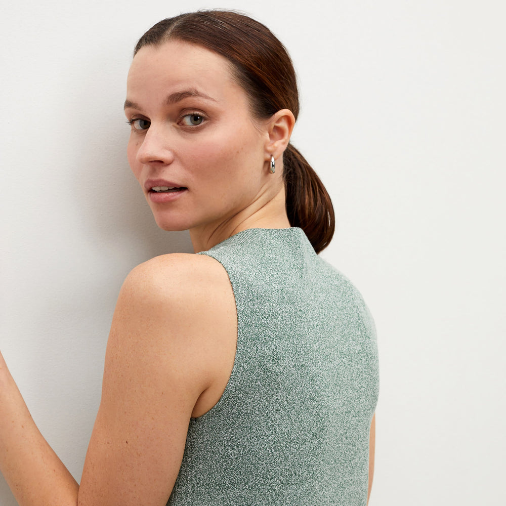 Detail image of a woman standing wearing the lyssa earrings in silver