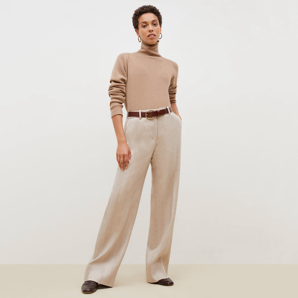 front image of a woman wearing the mckenzie sweater in deep flax