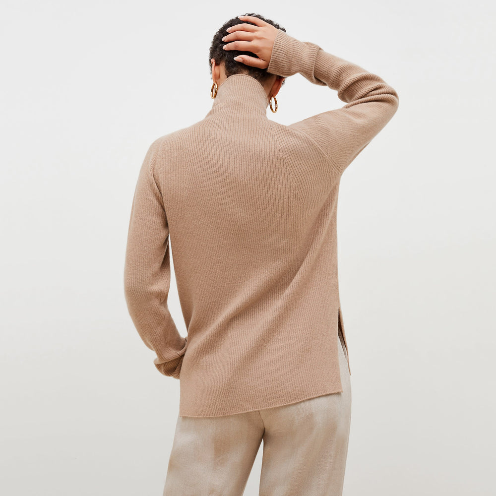 front image of a woman wearing the mckenzie sweater in deep flax