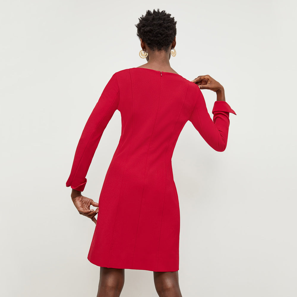 Back image of a woman standing wearing the Novara Dress—Recycled WonderTex in Rhubarb