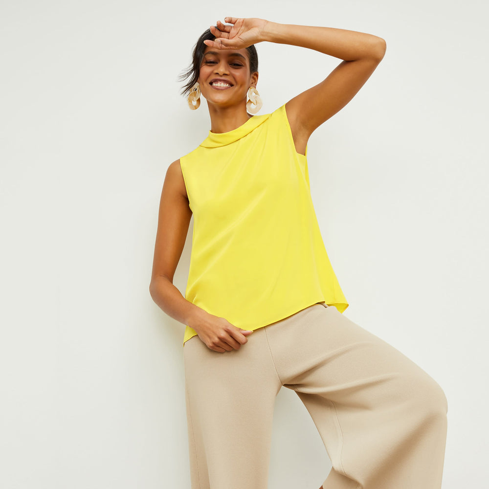 Front image of a woman standing wearing the rogala culotte in latte