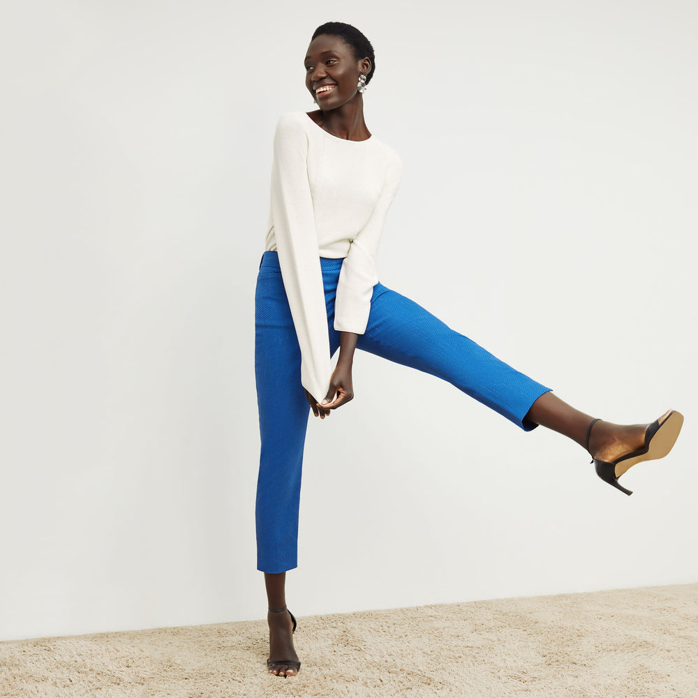 Front image of a woman standing wearing the condesa pant in basketweave jacquard in azure