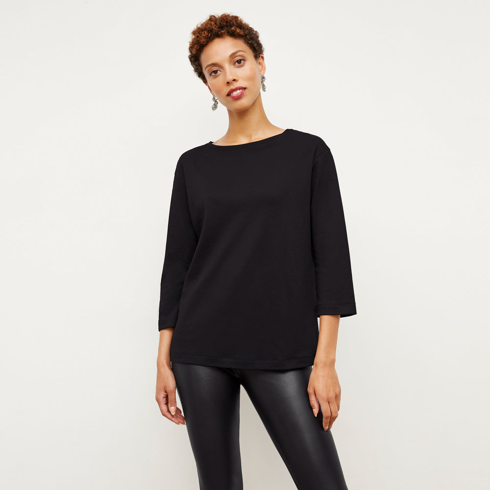 Front image of a woman wearing the Owen T-Shirt in Black