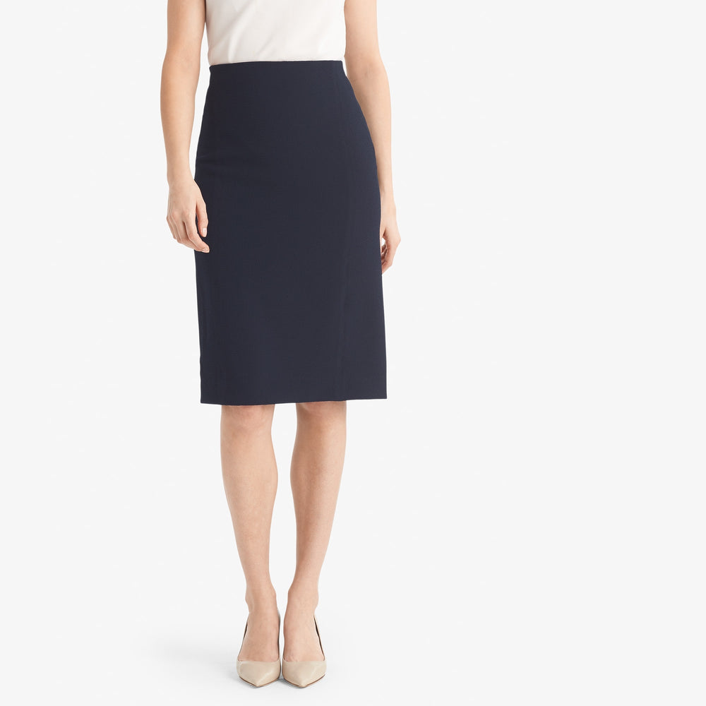 Front image of a woman standing wearing the Dorchester skirt staccato in galaxy blue