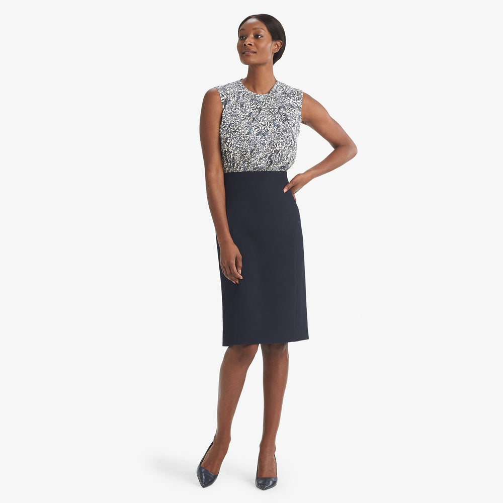 Front image of a woman standing wearing the Dorchester skirt staccato in galaxy blue