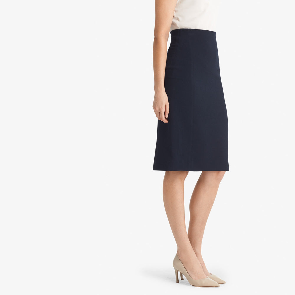 Side image of a woman standing wearing the Dorchester skirt staccato in galaxy blue
