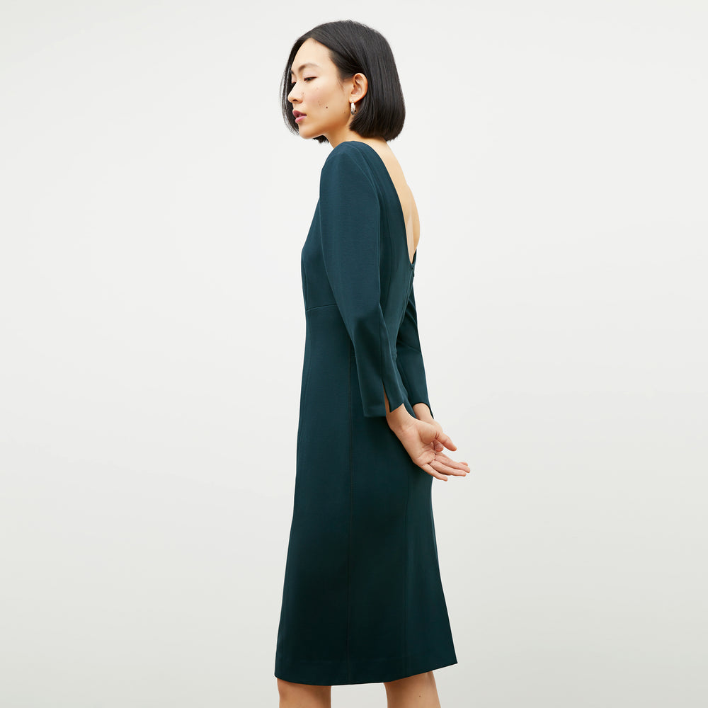 Side image of a woman wearing the Winston Dress in Deep Sea