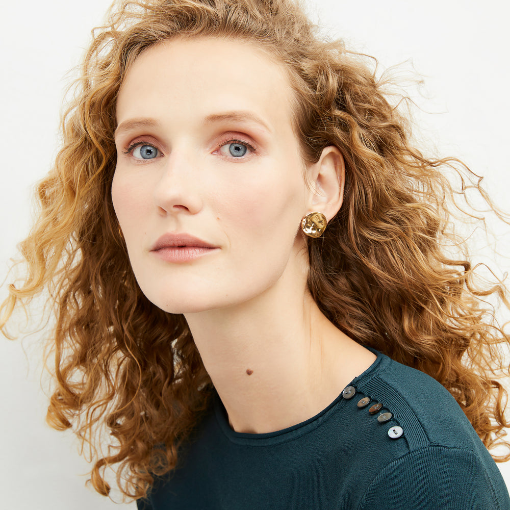 image of a woman wearing the yayoi earrings