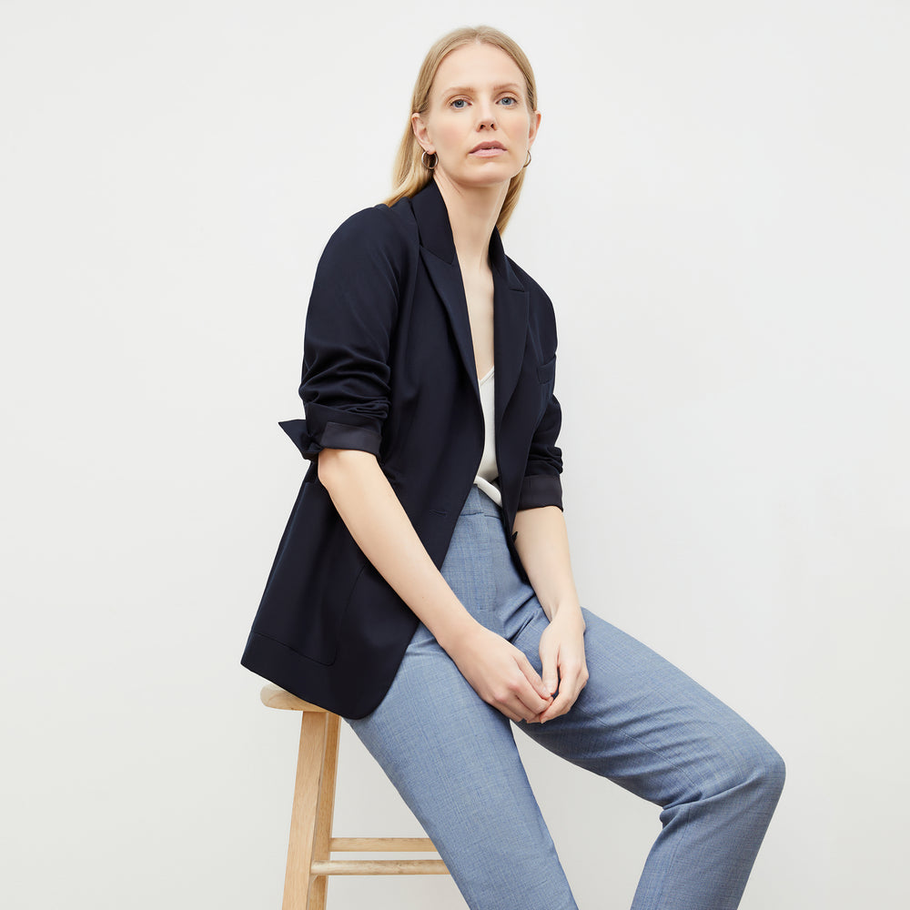 Front image of a woman wearing the mejia pant in indigo and white