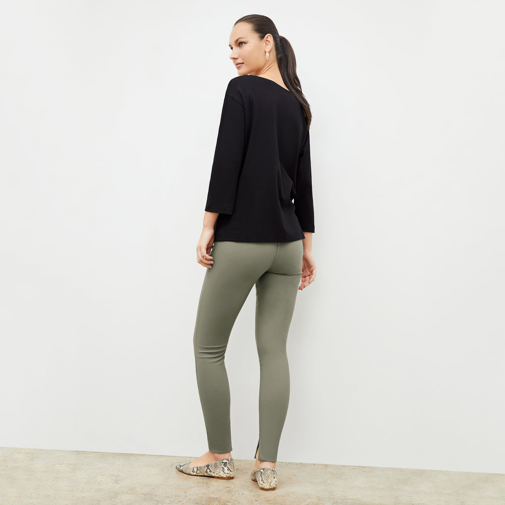 Back image of a woman wearing the Owen T-Shirt in Black