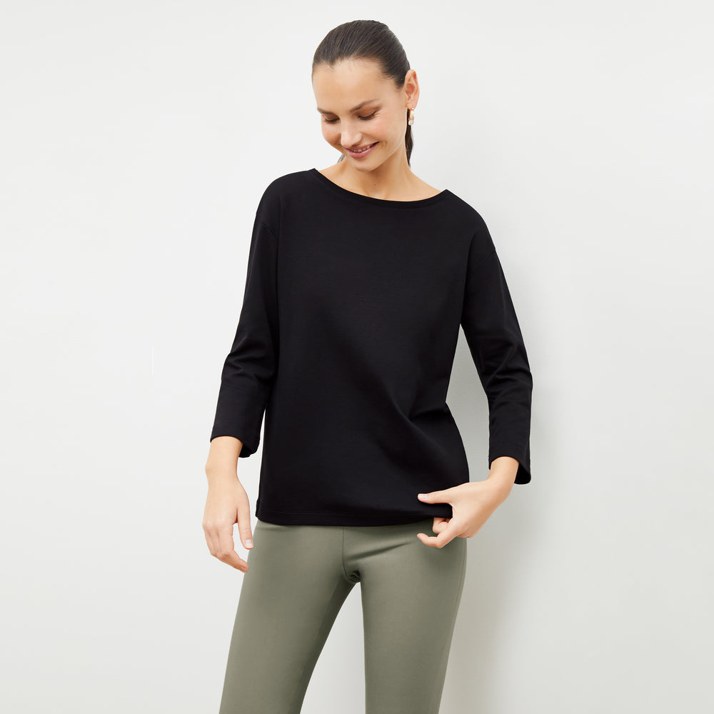 Front image of a woman wearing the Owen T-Shirt in Black
