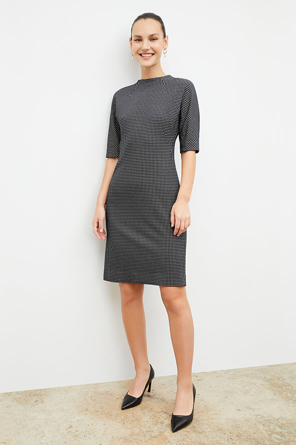 Front image of a woman wearing the farnoosh dress in black and white houndstooth