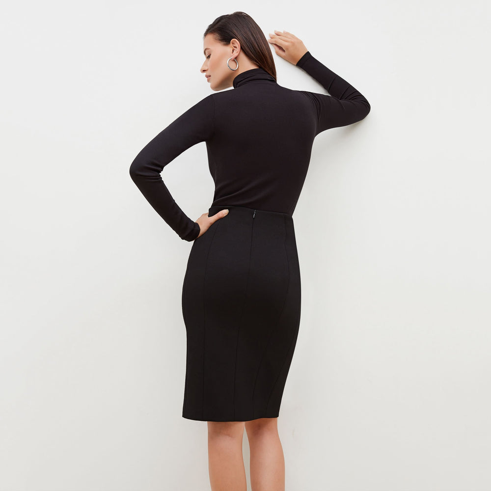Back image of a woman standing wearing the Cortlandt Skirt--Worth in Black