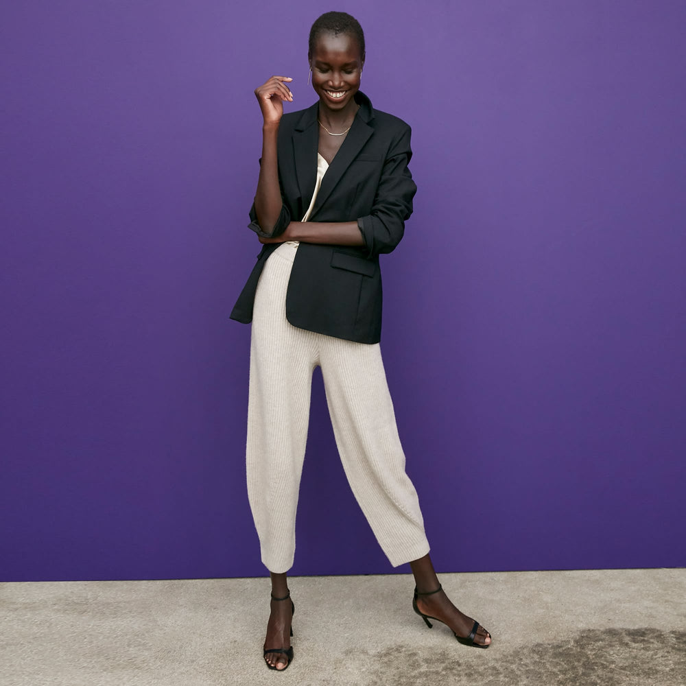 Front image of a woman standing wearing the Addison Jogger—Cashmere/Wool in Oatmeal Melange