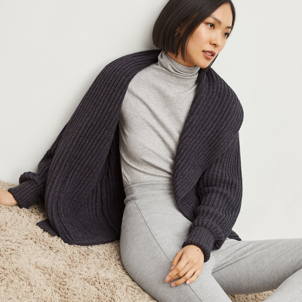 Side image of a woman standing wearing the Stella Legging in Gray Melange