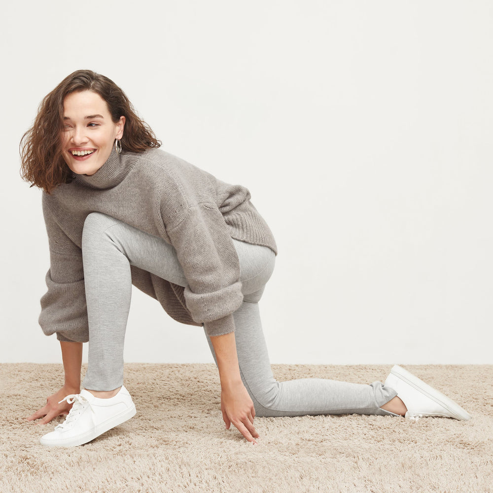 Side image of a woman standing wearing the Stella Legging in Gray Melange