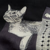 Image of a woman wearing a scarf with animals on it in black white and gray