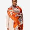 image of a woman wearing the les cheris scarf in red