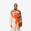 image of a woman wearing the les cheris scarf in red