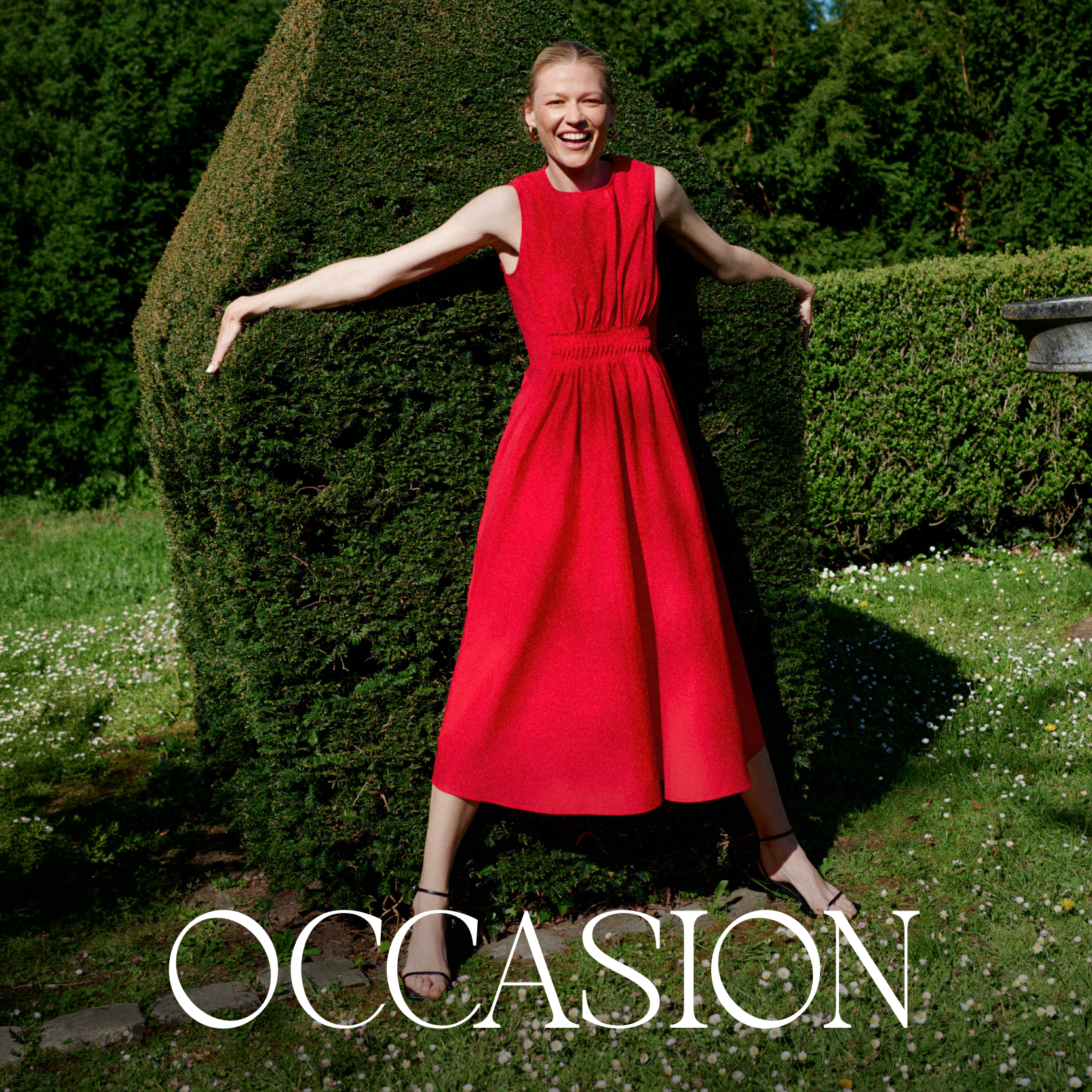 Woman in a red dress standing in front of a bush with 'OCCASION' text overlay.