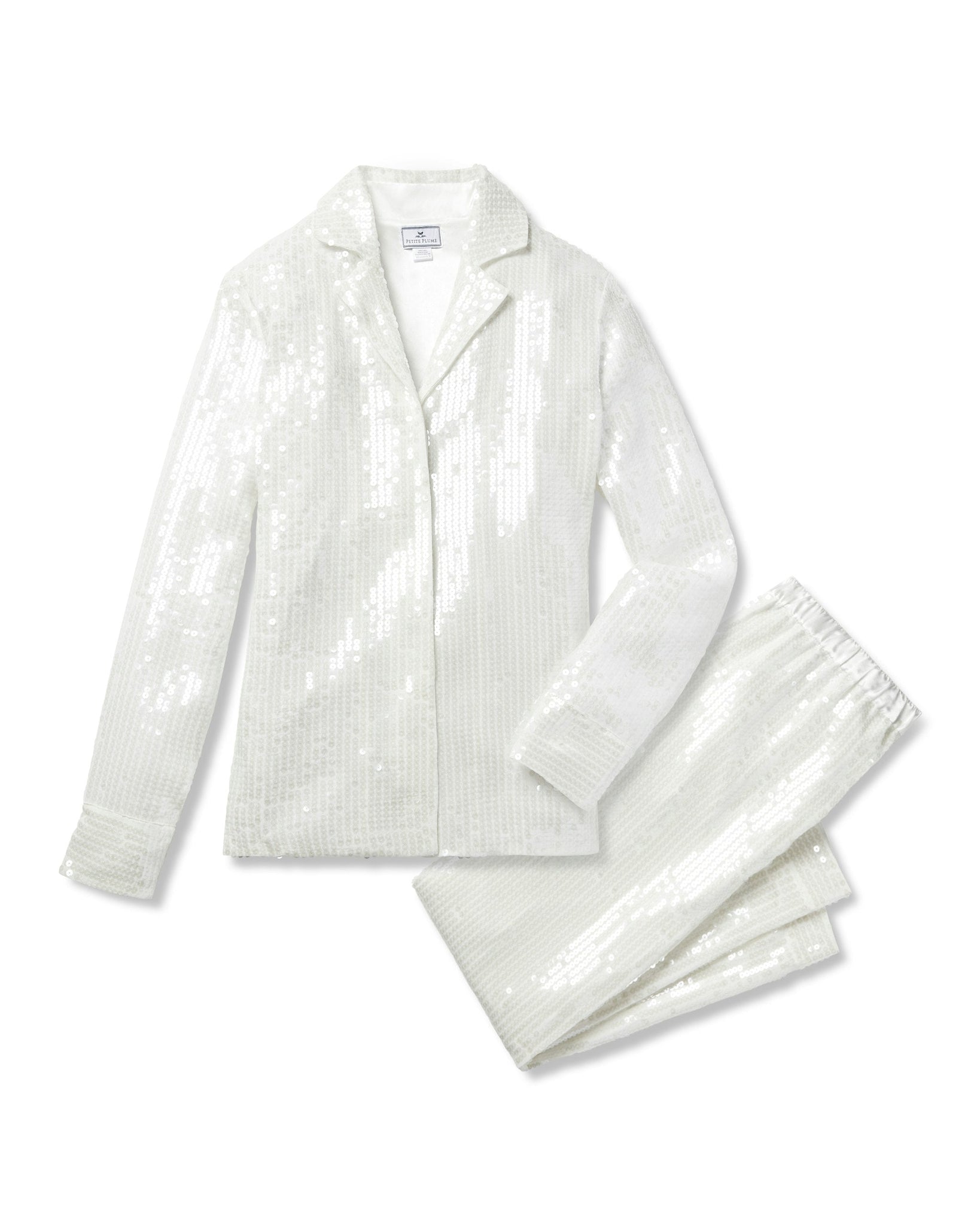White sequin jacket and pants set on a white background