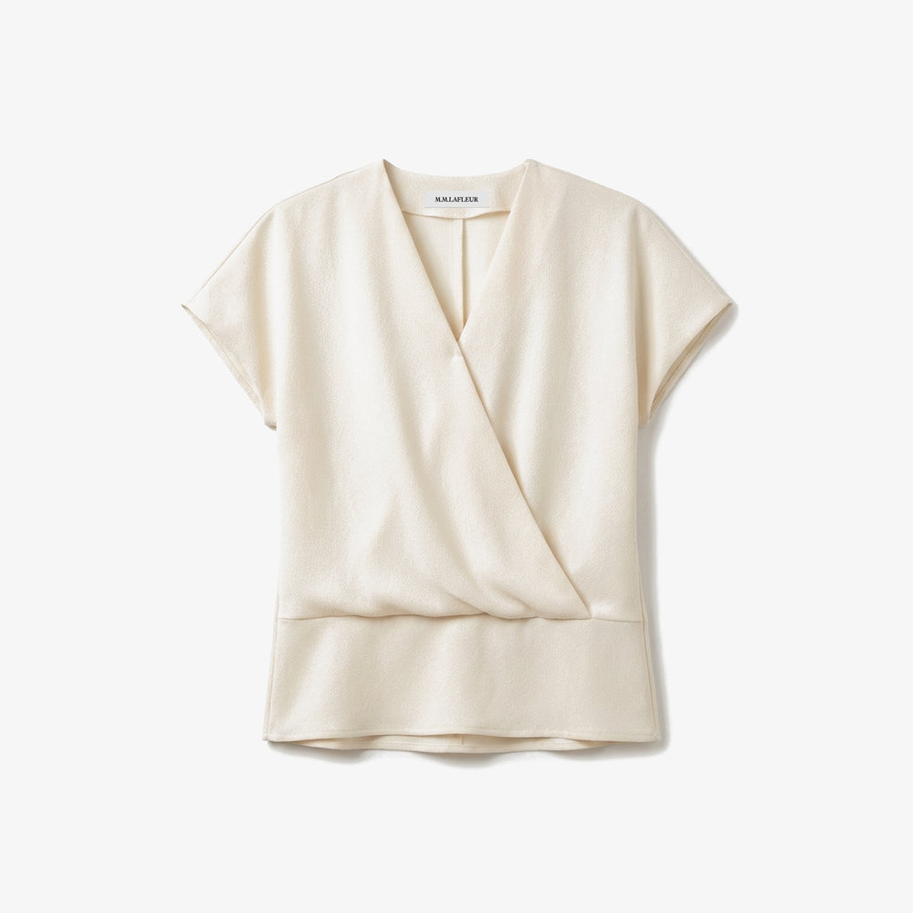 Cream-colored blouse on a white background