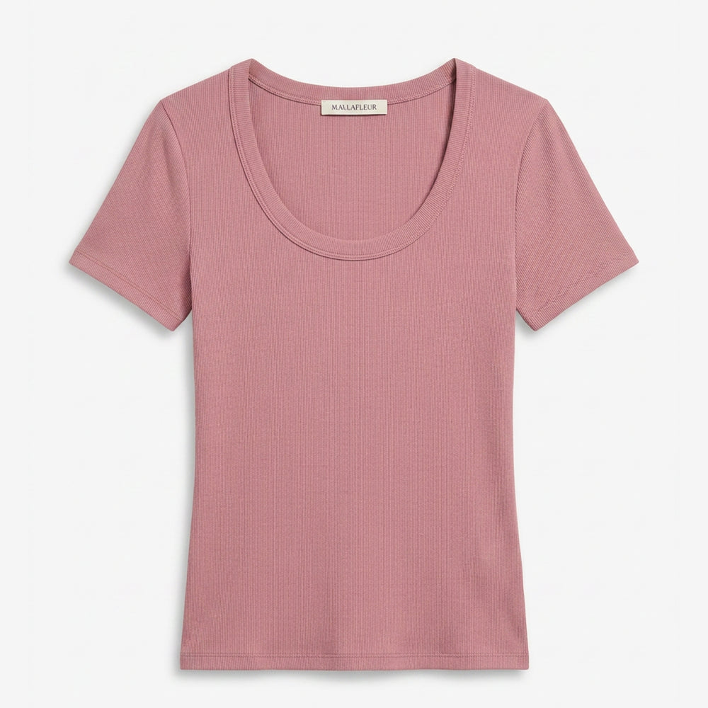 Pink t-shirt with 'Maison Martin Margiela' label on a white background