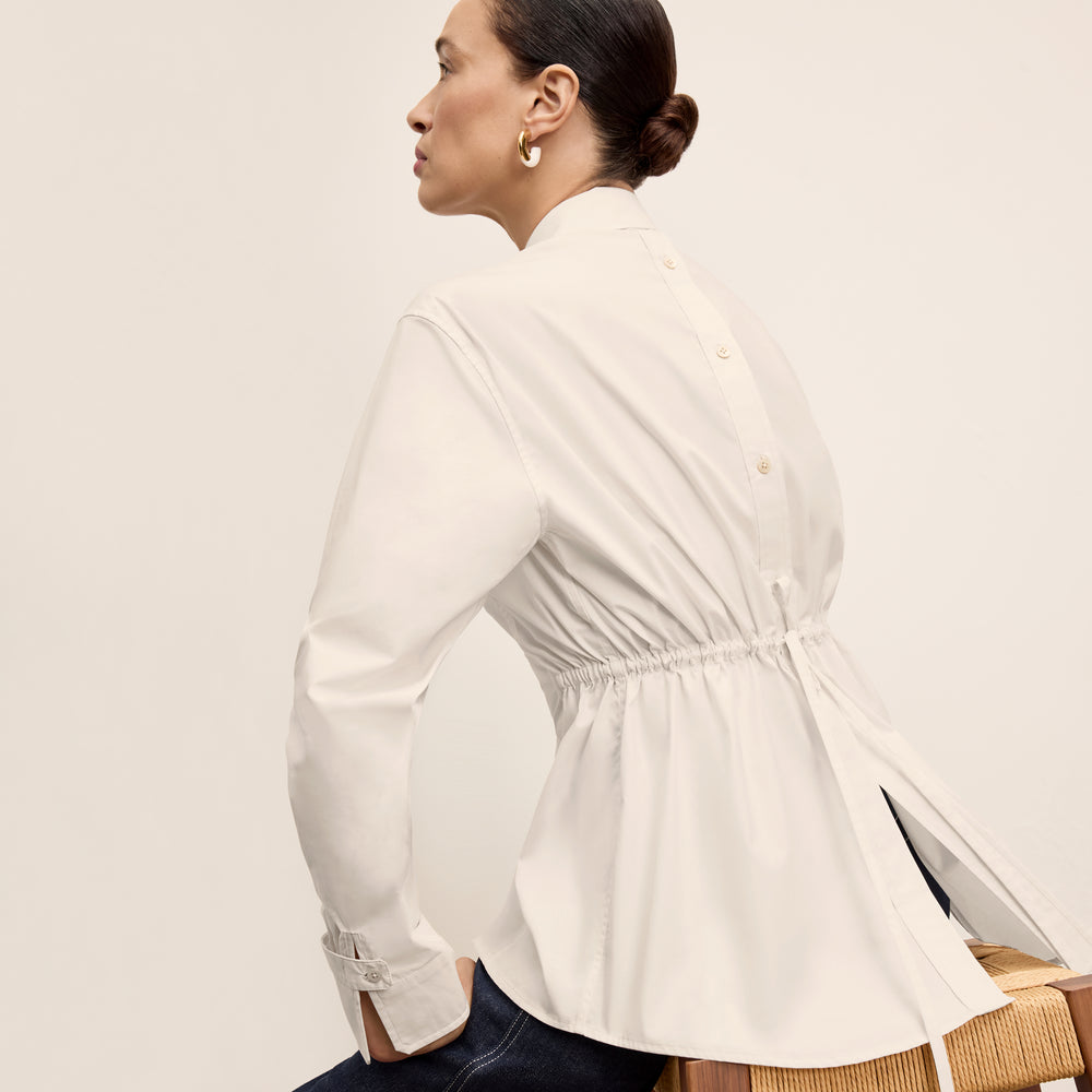 front image of a woman wearing the bentley shirt in eggshell