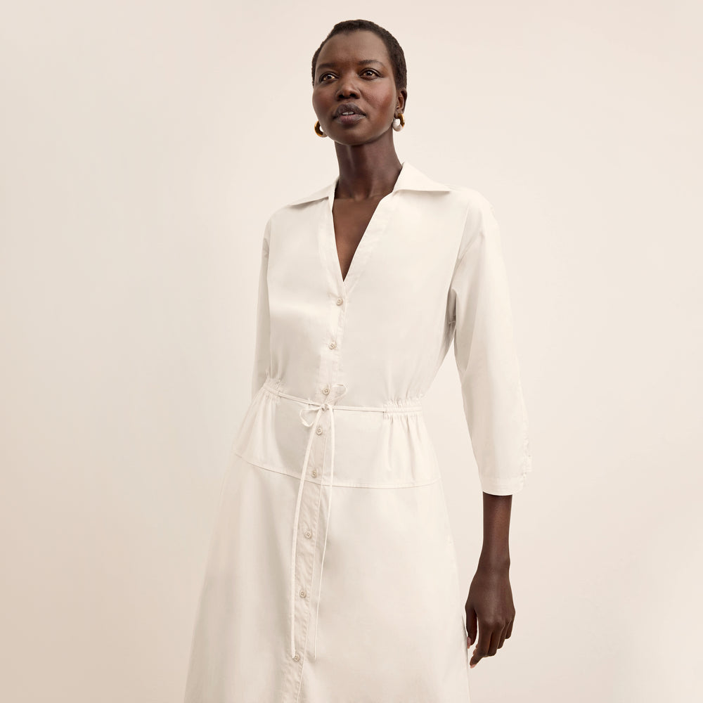 front image of a woman wearing the boden dress in eggshell