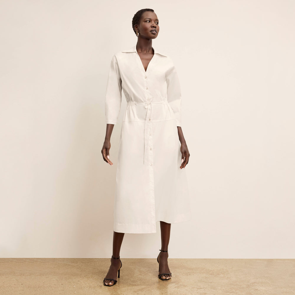 front image of a woman wearing the boden dress in eggshell