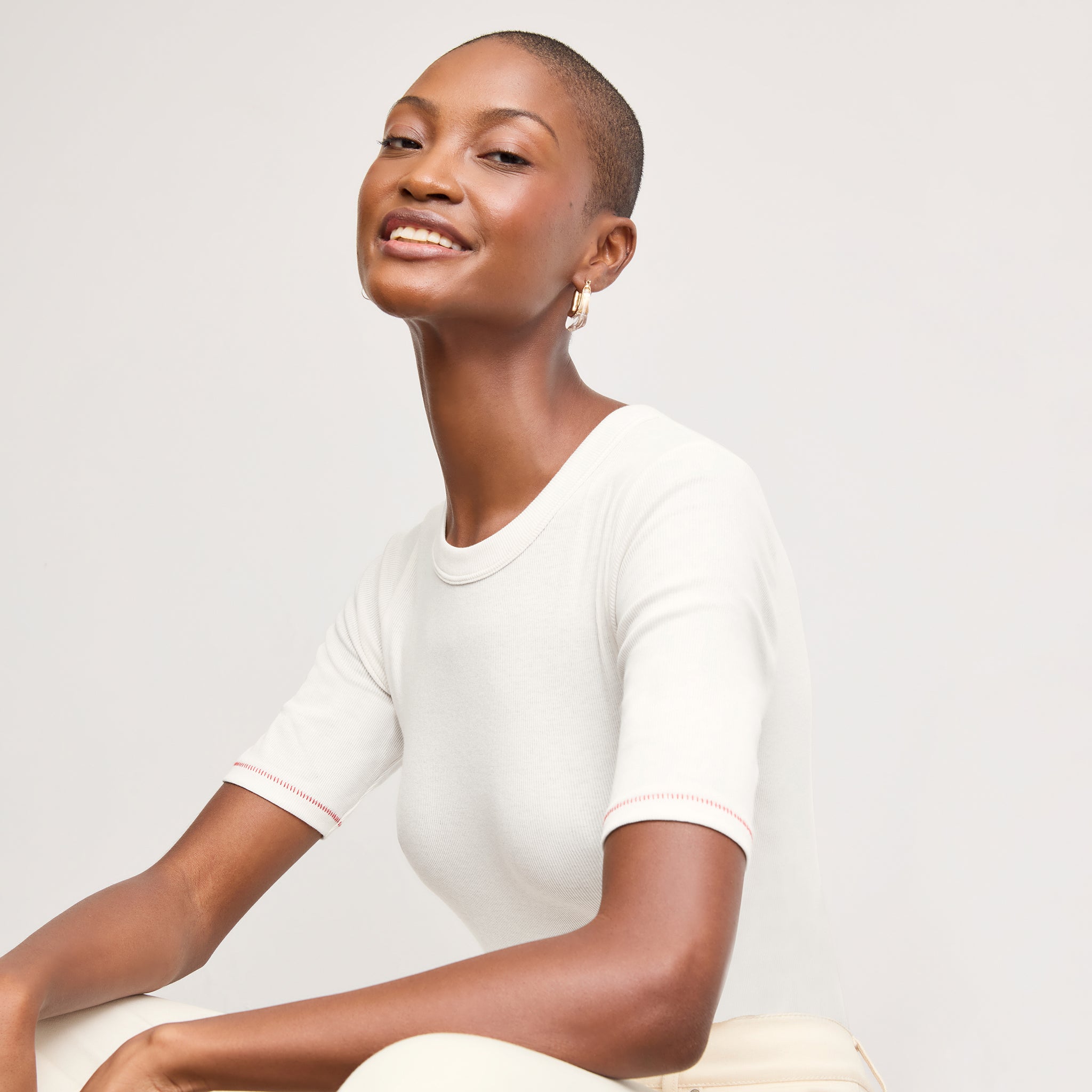 front image of a woman wearing the chana top in white 