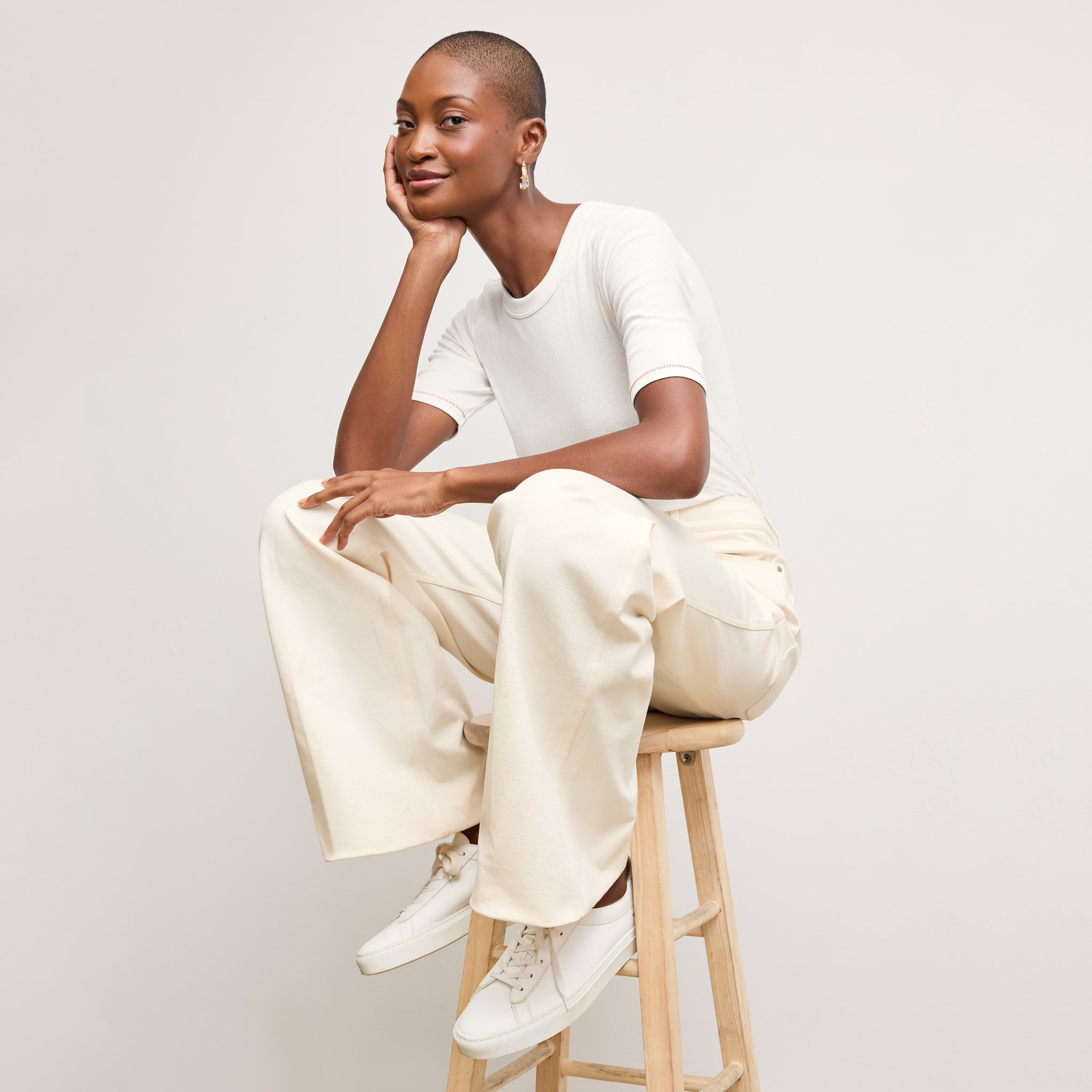 front image of a woman wearing the chana top in white