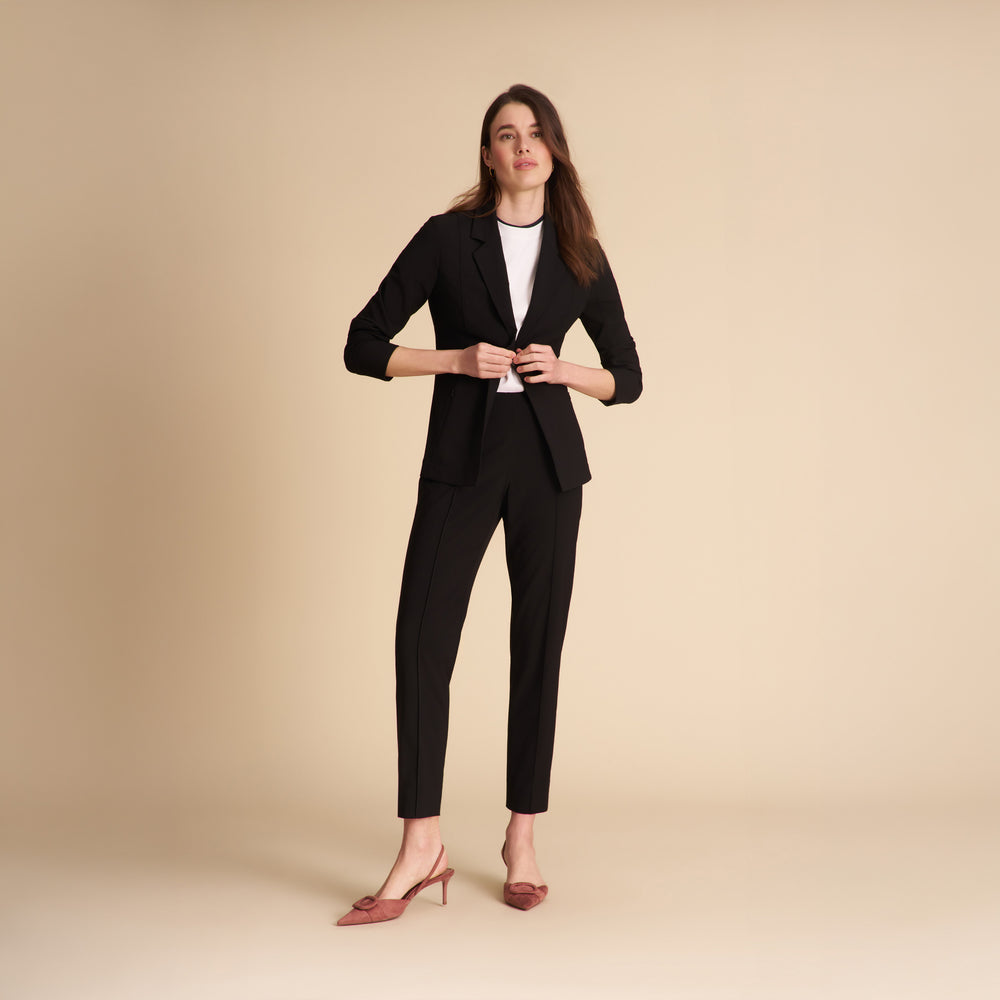 Front image of a woman standing wearing the Colby Jogger in Black