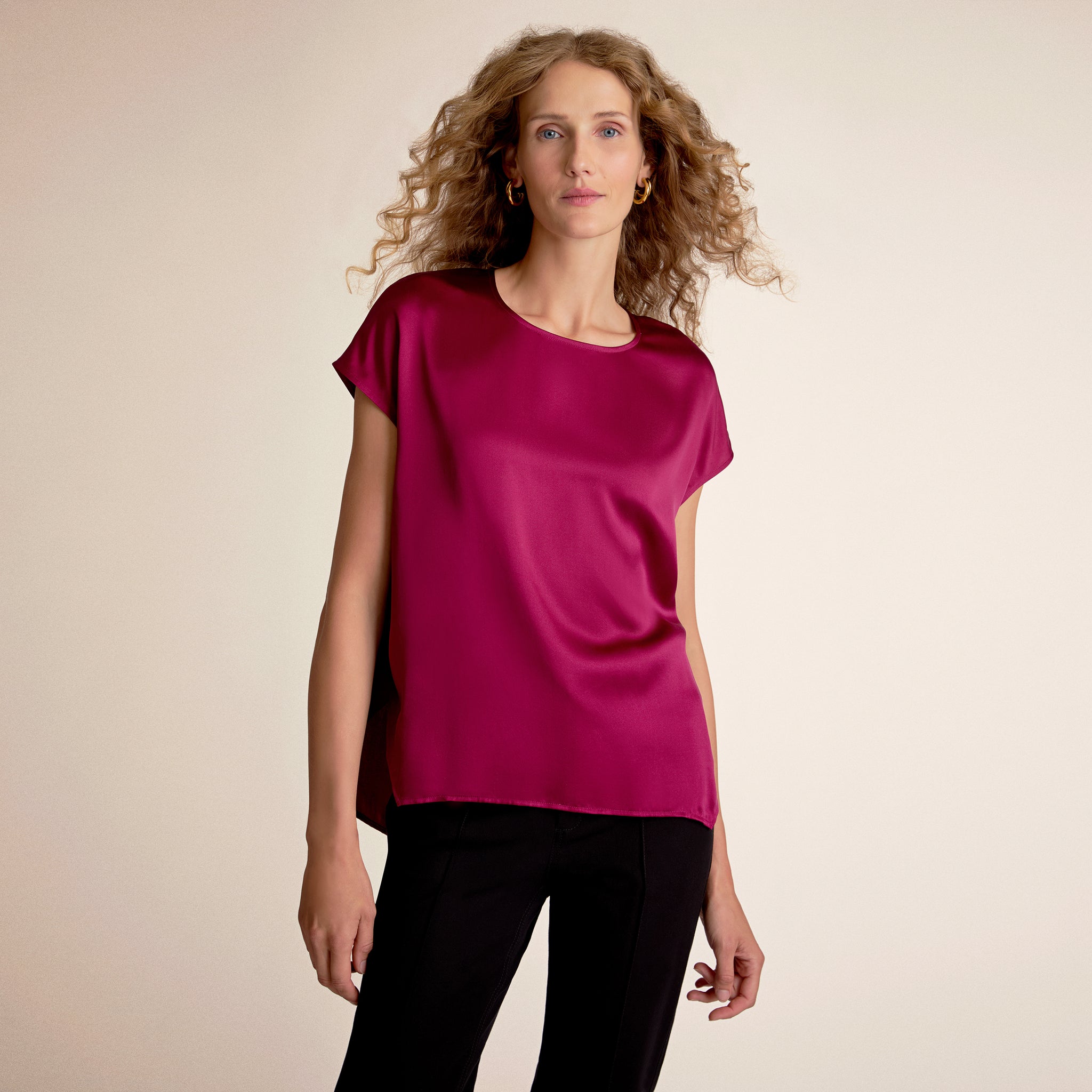 Woman wearing the didion top in dark fuchsia 