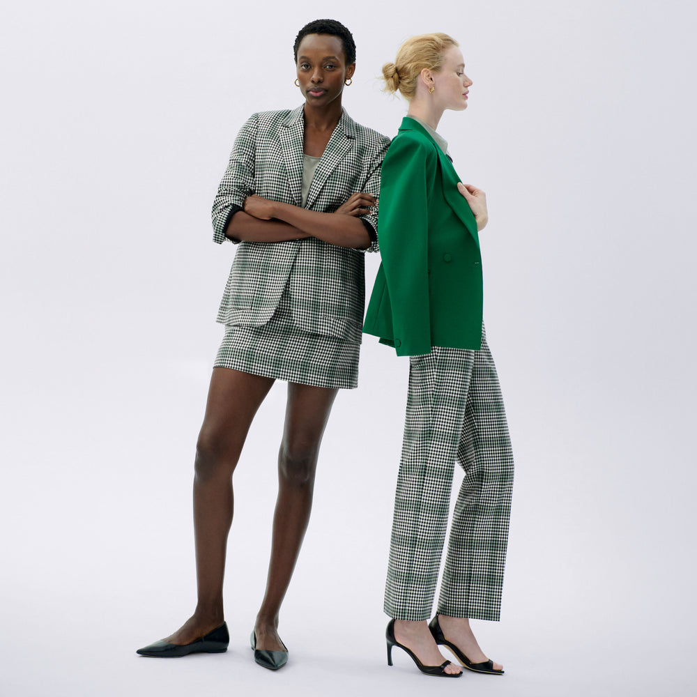 side image of a woman wearing the kenny jacket in shamrock