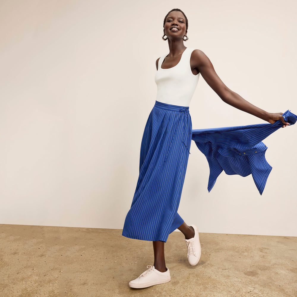 front image of a woman wearing the easton skirt in soft stripe