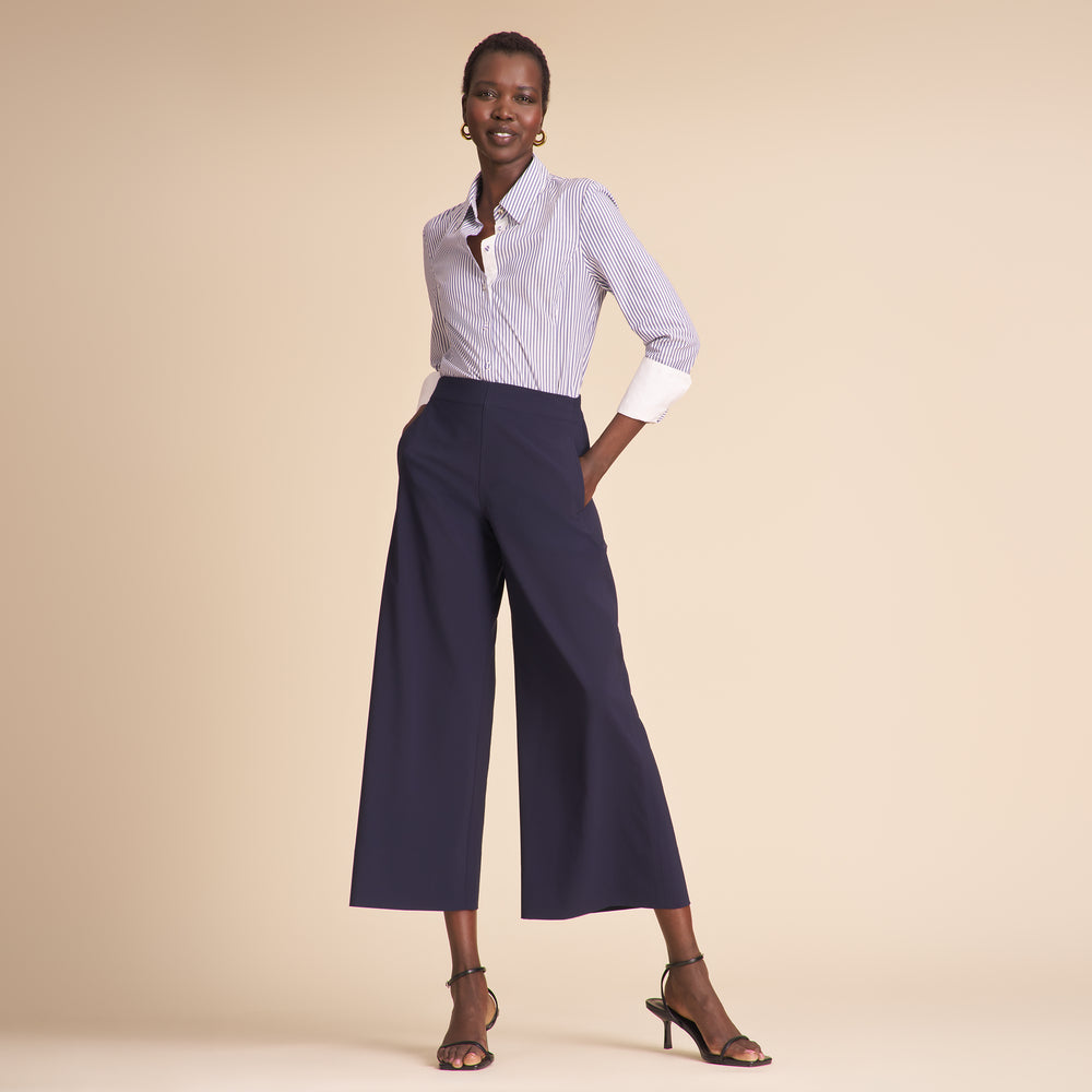 front image of a woman wearing the elena pants in dark navy