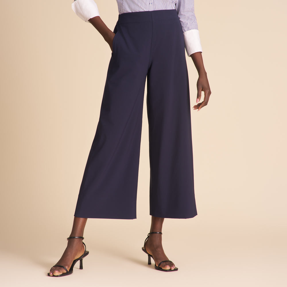 front image of a woman wearing the elena pants in dark navy