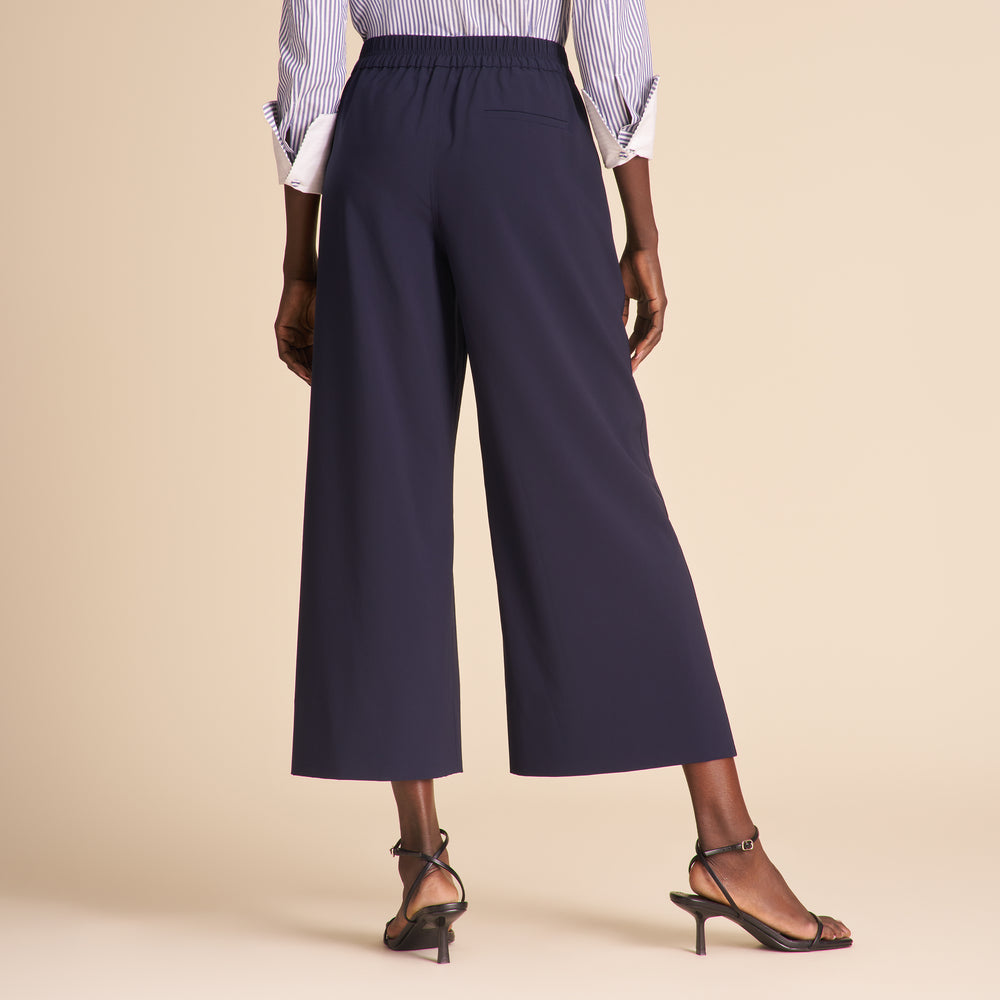 front image of a woman wearing the elena pants in dark navy