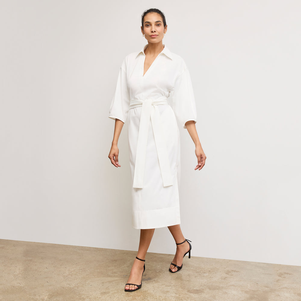 Front image of a woman wearing the Fanfan Dress in White