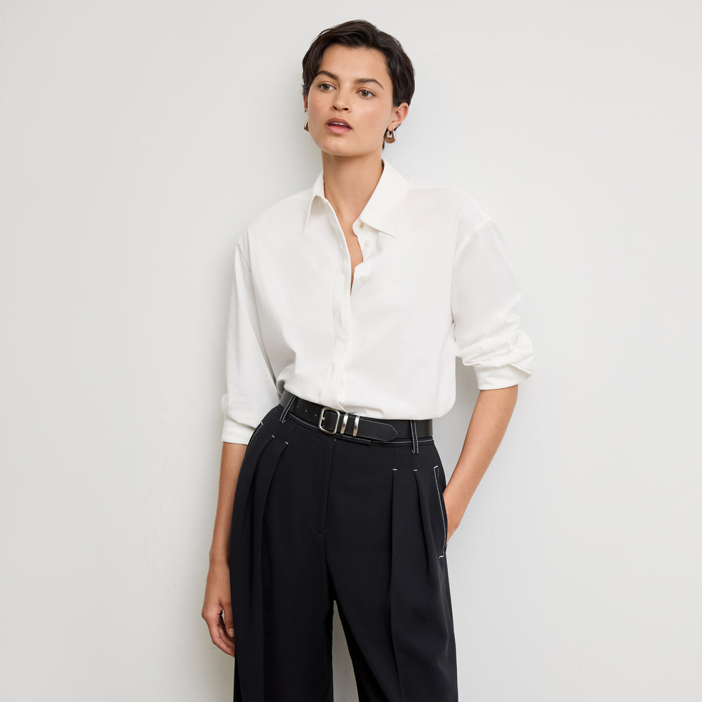 front image of a woman wearing the filomina top in white