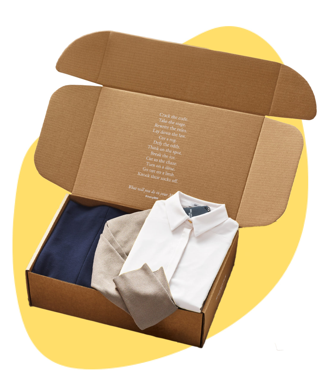 Open cardboard box with folded clothes on a yellow background
