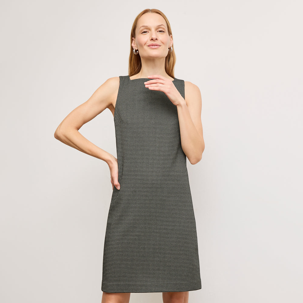 front image of a woman wearing the joanie dress in classic check