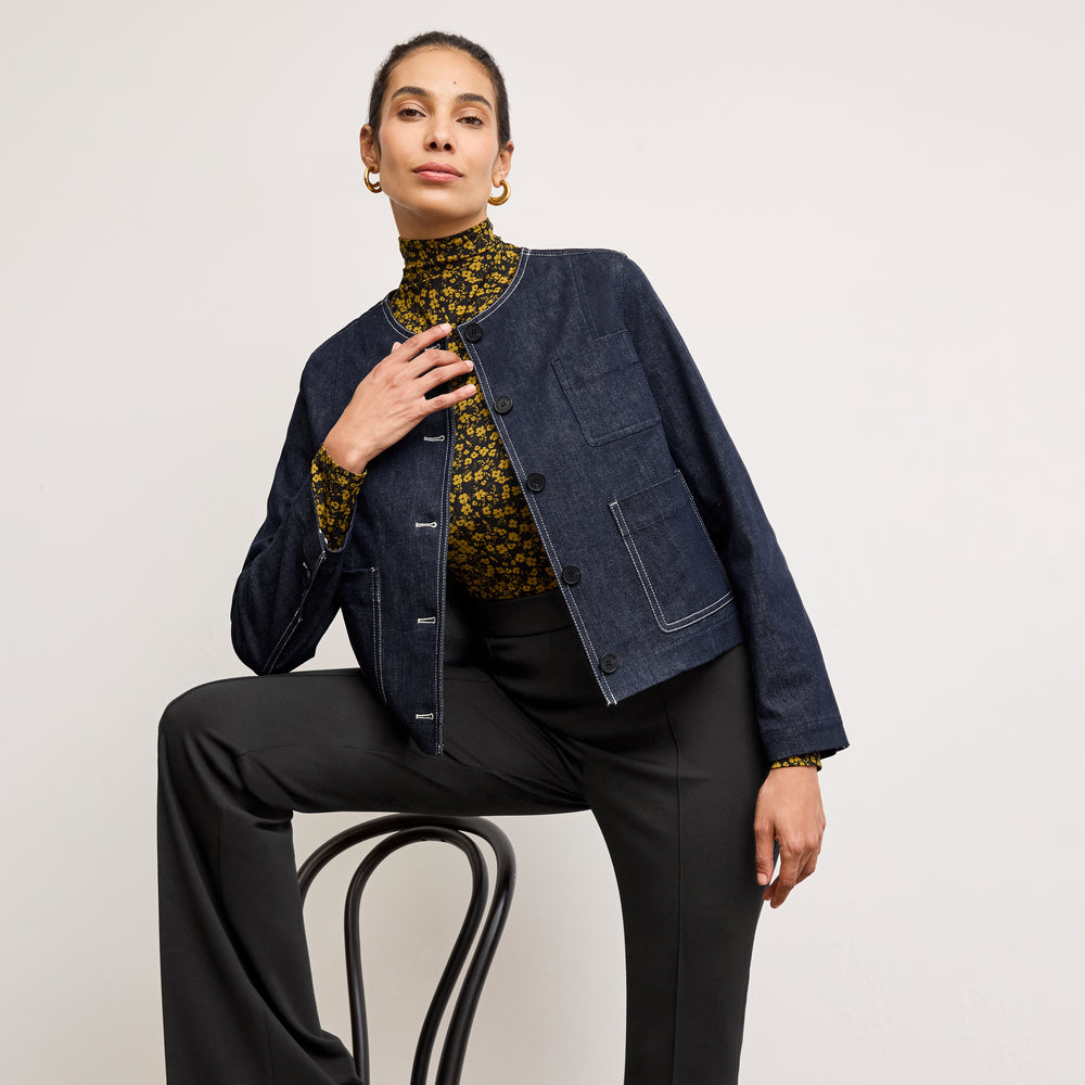 front image of a woman wearing the kane jacket in midnight wash