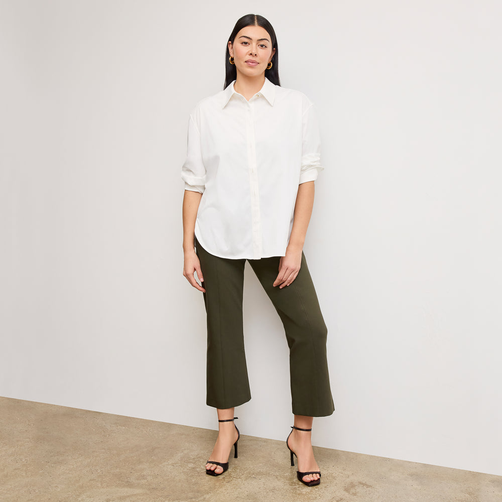 front image of a woman wearing the kick flare foster pants in olive
